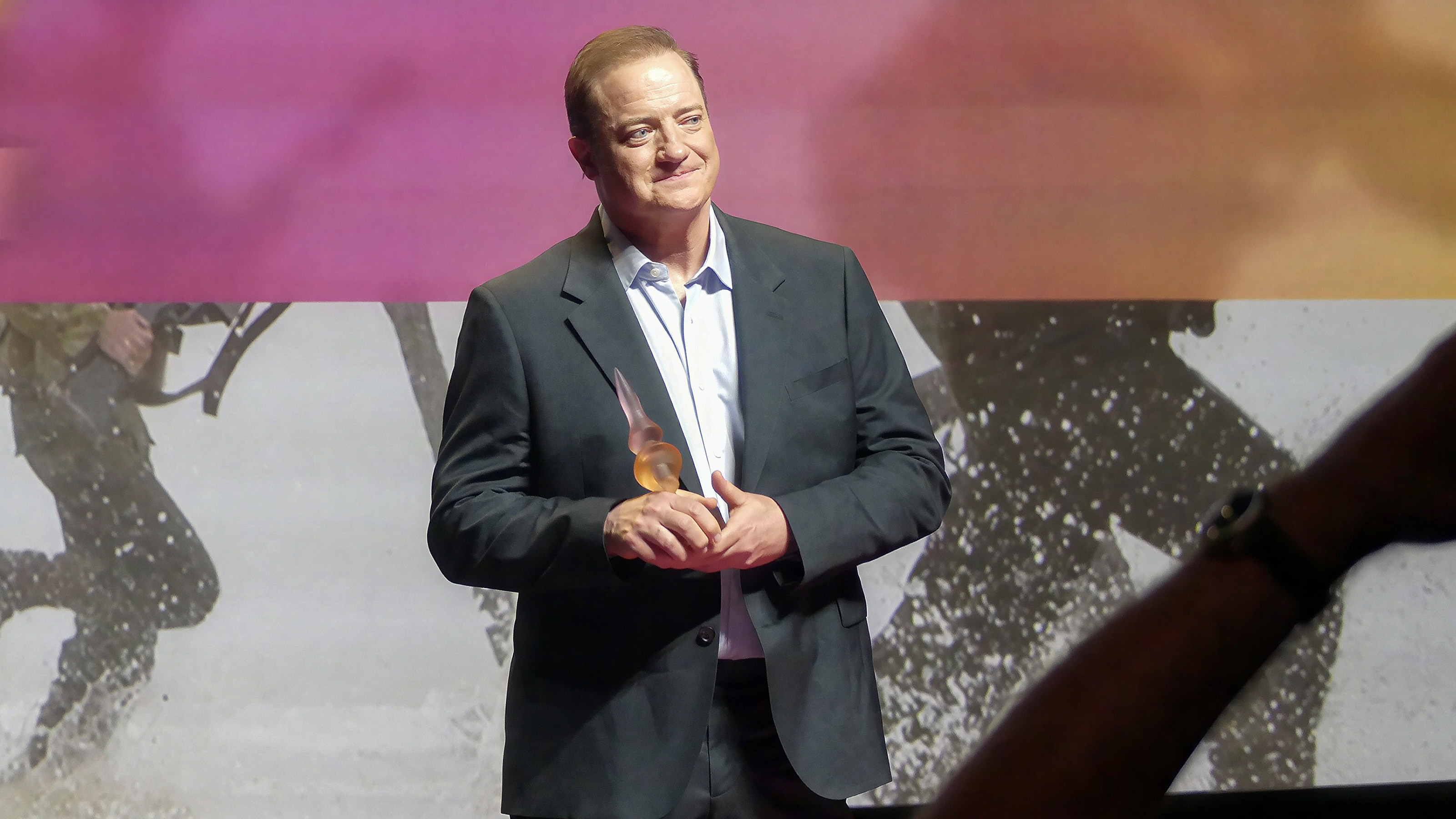 Brendan Fraser holds his Deauville Talent Award at the 2026 Deauville American Film Festival.