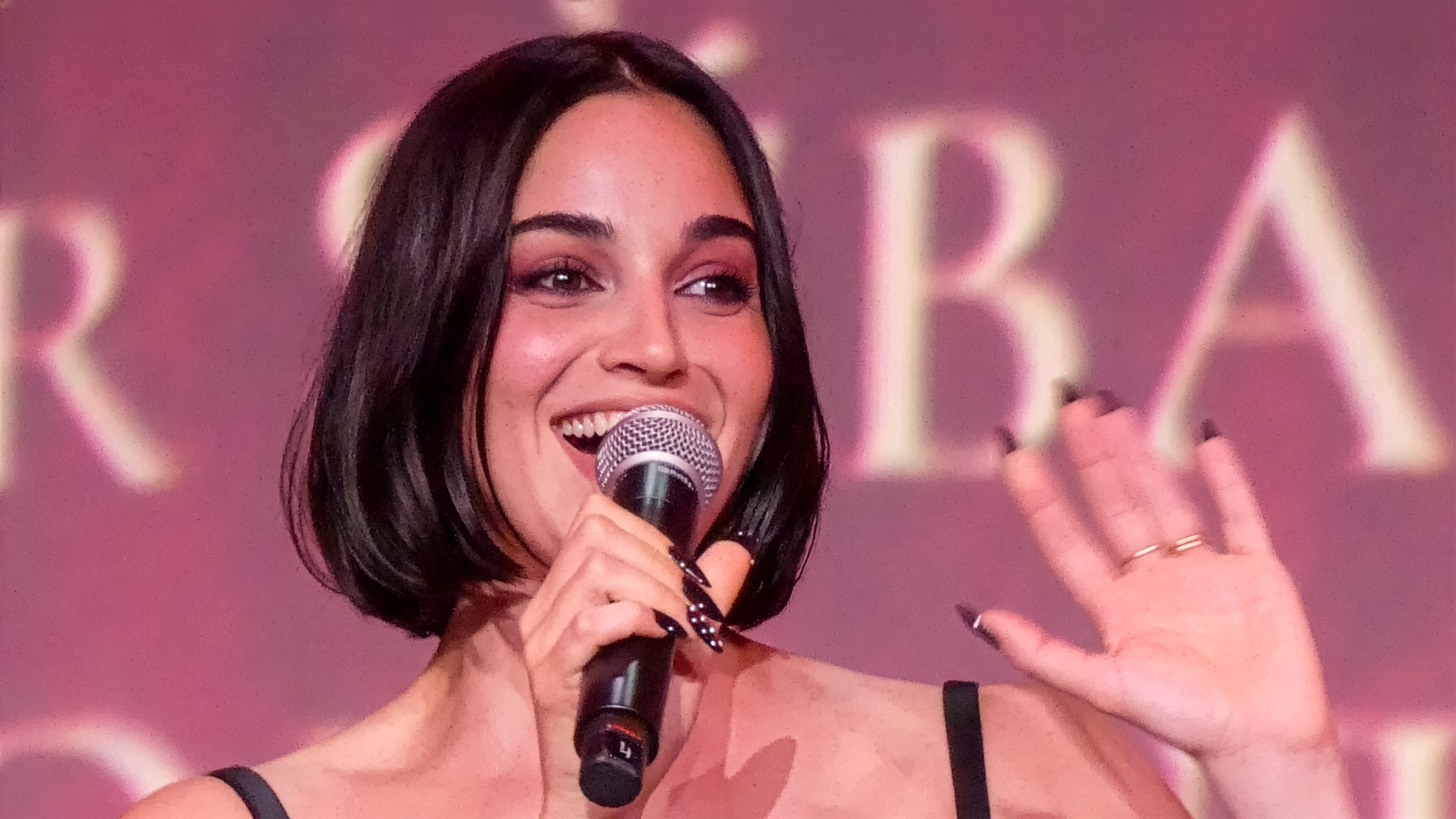 Luciane Buchanan greets fans during the Evil Dead Burn premiere event in Paris.